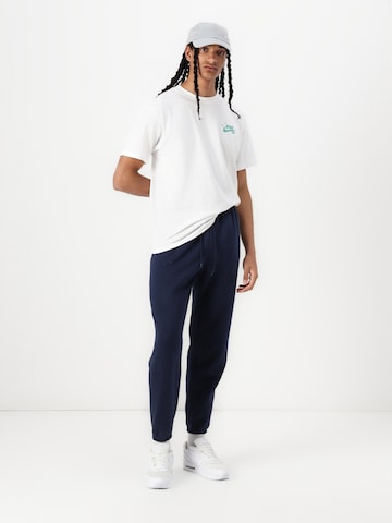 Nike Sportswear Tapered Trousers 'CLUB' in Blue