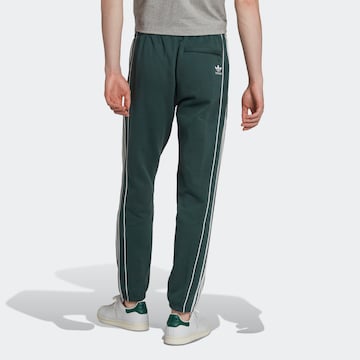 Tapered Pantaloni 'Rekive' di ADIDAS ORIGINALS in verde