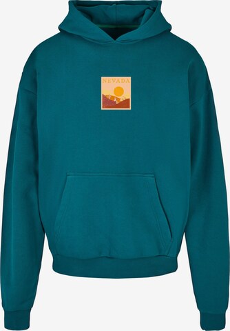 Merchcode Sweatshirt ' Peanuts ' in Groen: voorkant