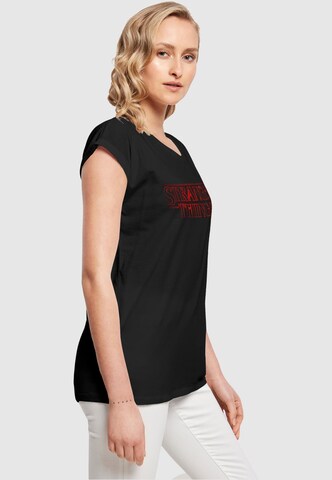 ABSOLUTE CULT Shirt 'Stranger Things - Glow' in Zwart