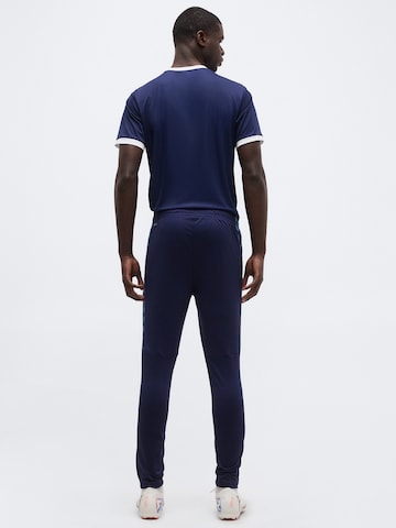 Coupe slim Pantalon de sport 'TeamLIGA26' PUMA en bleu