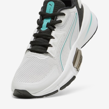 PUMA - Sapatilhas baixas 'PWRFRAME TR 3' em cinzento