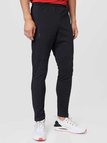 UNDER ARMOUR Skinny Workout Pants in Black: front