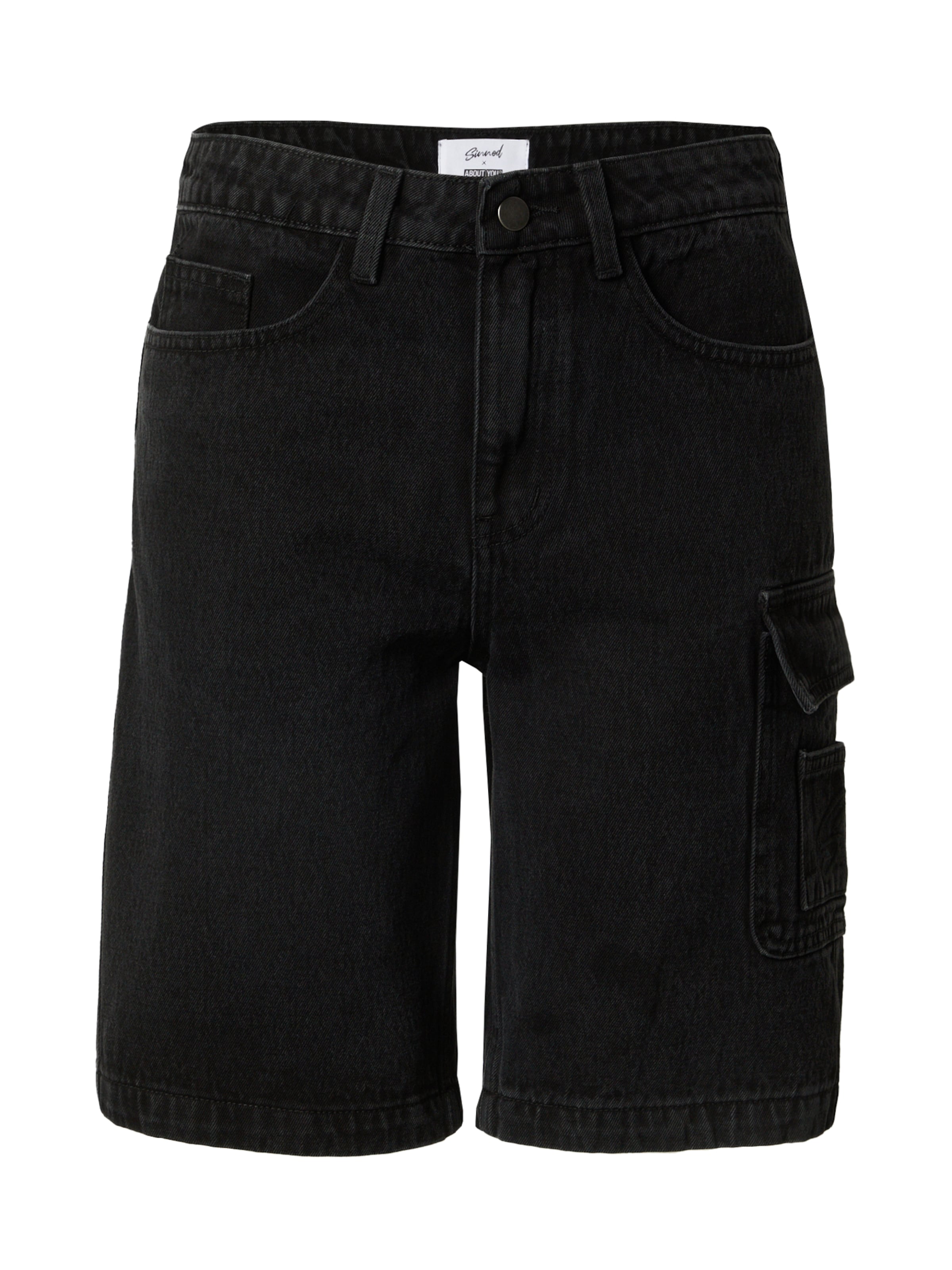 Sinned x ABOUT YOU tavaline Klapptaskutega teksapüksid 'Zehra', värv must: eest vaates