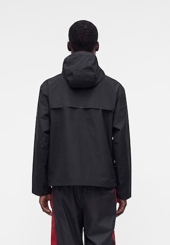 juoda Nike Sportswear Demisezoninė striukė