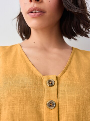 Combinaison Next en jaune