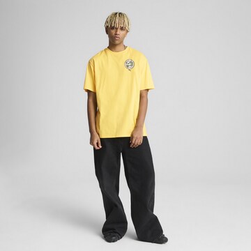 PUMA Shirt 'Graphics' in Yellow