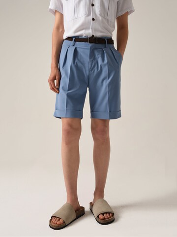 Antioch Loose fit Pleat-front trousers in Blue: front