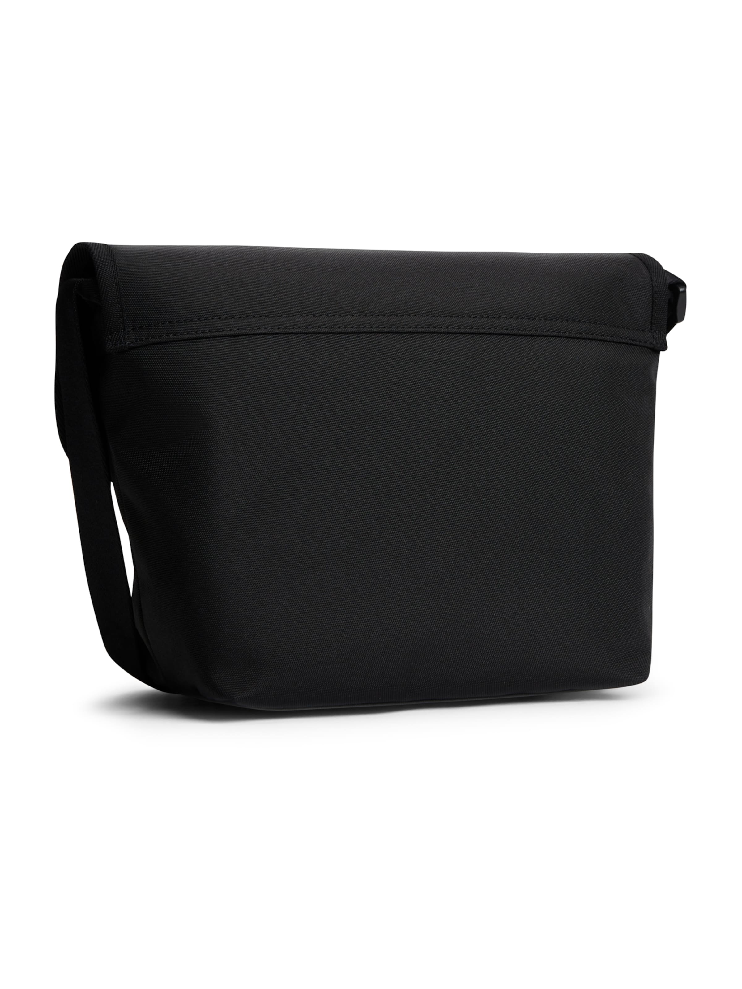 Tommy Jeans Axelremsväska 'ESS DAILY' i svart