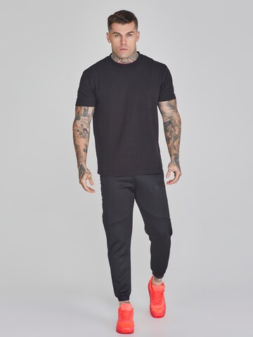 Effilé Pantalon cargo SikSilk en noir
