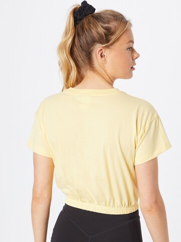 Maglia funzionale di Champion Authentic Athletic Apparel in giallo