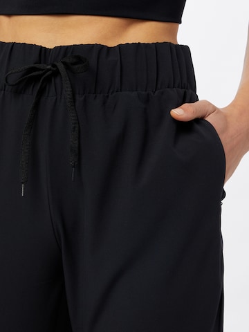 Athlecia - Tapered Pantalón deportivo 'Austberg' en negro