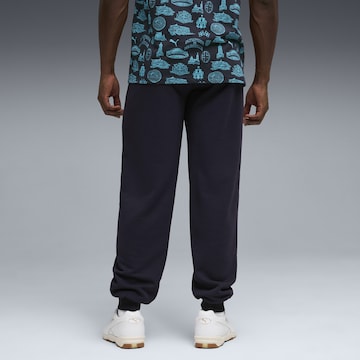 PUMA Tapered Sports trousers in Blue