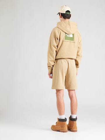 Regular Pantaloni 'BOX NSE' de la THE NORTH FACE pe verde