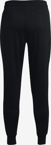 Effilé Pantalon de sport UNDER ARMOUR en noir