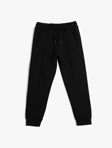 Koton Tapered Trousers in Black: front