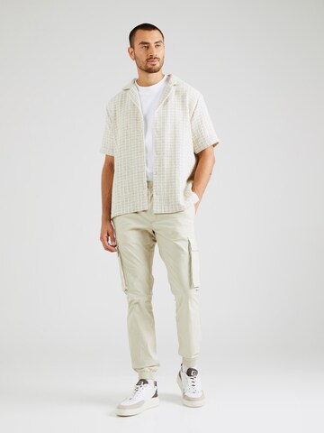 Calvin Klein Jeans Tapered Cargohose in Beige