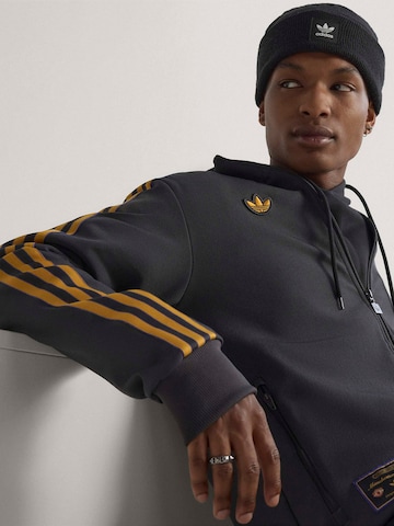 ADIDAS ORIGINALS - Sudadera con cremallera deportiva 'Manchester United Terrace Icons' en negro