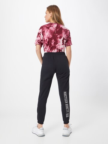 UNDER ARMOUR Tapered Sportbroek in Zwart