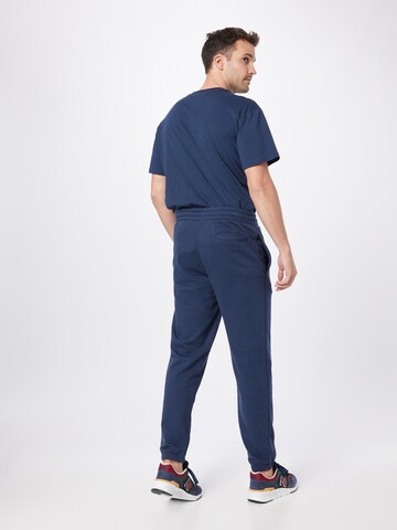 Effilé Pantalon de sport new balance en bleu