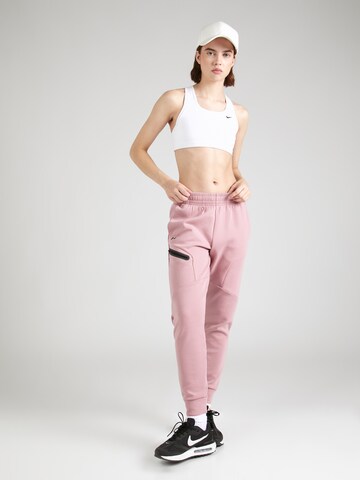 Effilé Pantalon de sport 'Unstoppable' UNDER ARMOUR en rose