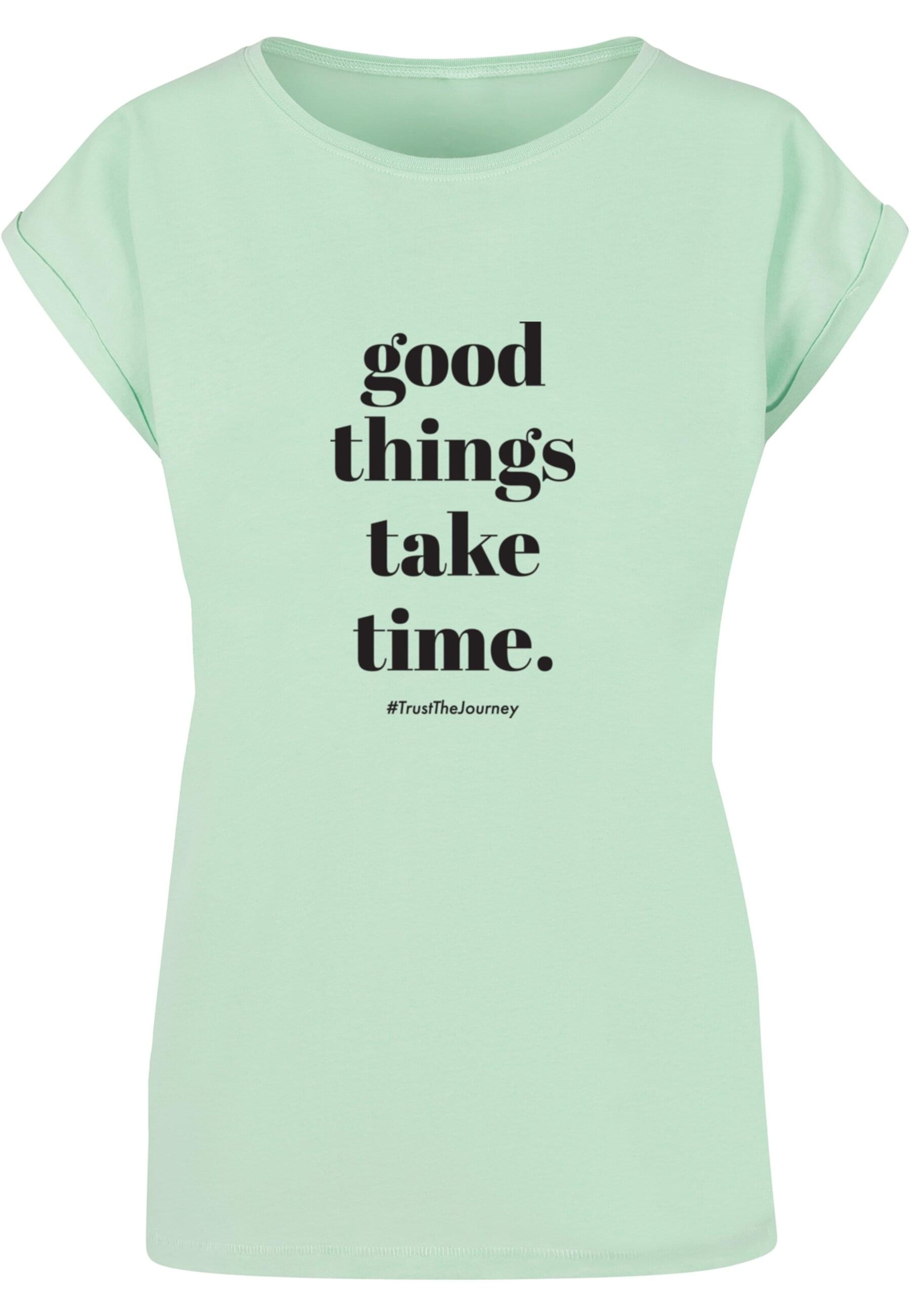 Merchcode T-Shirt 'Good Things Take Time' in Grün: Vorderseite