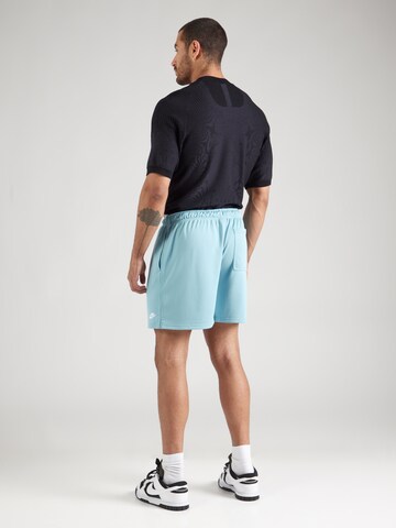 Regular Pantaloni 'CLUB FLOW' de la Nike Sportswear pe albastru