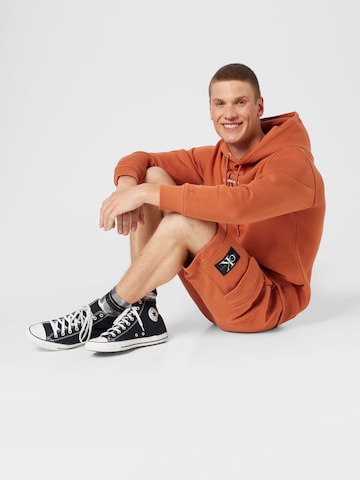 Calvin Klein Jeans Regular Broek in Oranje