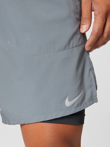 NIKE Regular Sports trousers in Grey