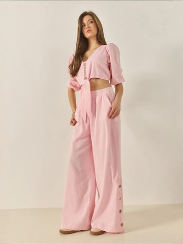 Completo pantalone di Bianco Lucci in rosa