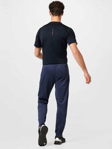 Effilé Pantalon de sport 'Legacy Poly' Hummel en bleu