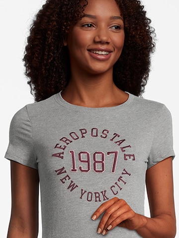 AÉROPOSTALE - Camisa 'JKI 1987' em cinzento