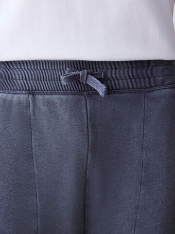 pilka Next Plačios klešnės Kelnės