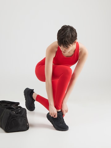 Skinny Pantalon de sport 'OASIS' Fabletics en rouge