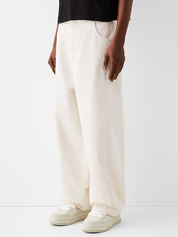 Bershka Wide leg Jeans in Beige: front