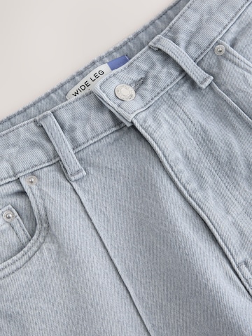 Next Široke hlačnice Kavbojke | siva barva