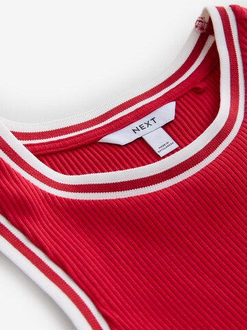 Haut Next en rouge