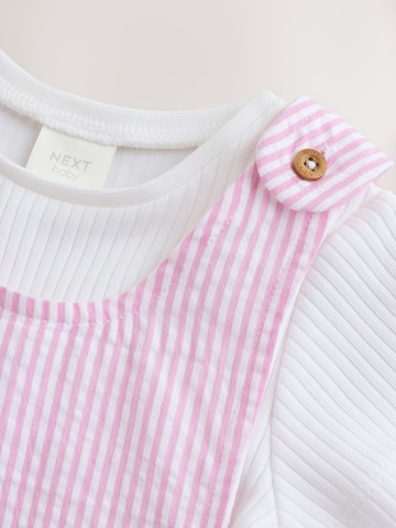 Set de la Next pe roz