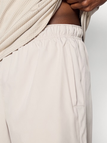 NIKE regular Παντελόνι φόρμας 'CHALLENGER' σε ροζ