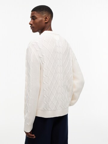 Pull-over Tommy Jeans en blanc