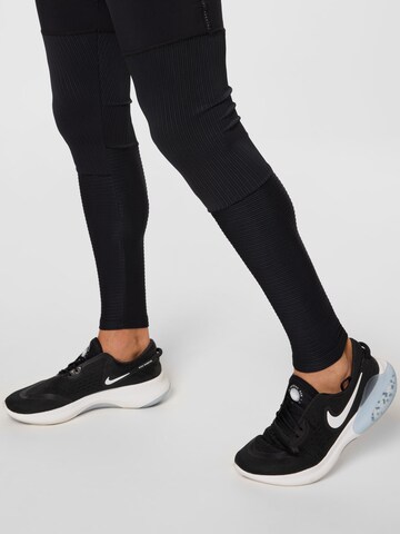 NIKE Skinny Sportovní kalhoty 'Phenom Run Division' – černá