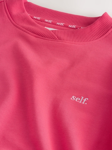 Sweat-shirt self. en rose