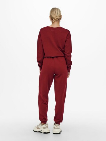 Effilé Pantalon de sport ONLY PLAY en rouge