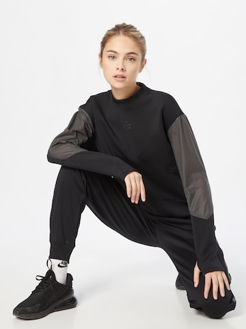 NIKE Sportsweatshirt 'Run Divsion' in Schwarz