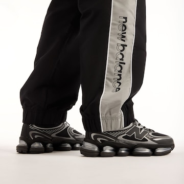 new balance - Tapered Pantalón en negro