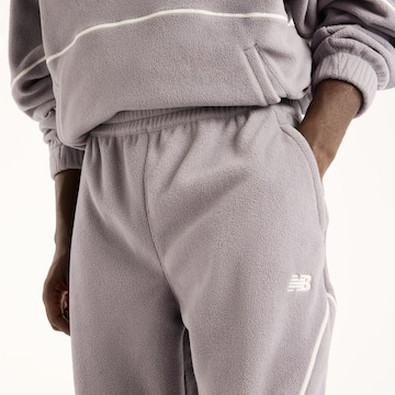 new balance - Perna larga Calças 'Trackside Polar Fleece Jogger' em cinzento