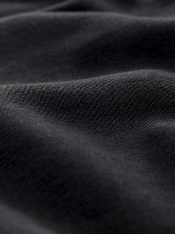 Next Дънки Tapered Leg Панталон в черно