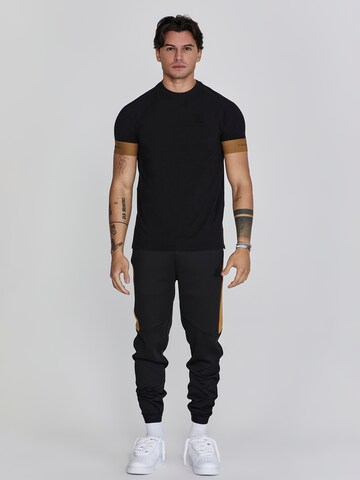 Tapered Pantaloni sportivi di SikSilk in nero