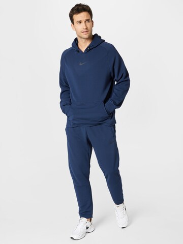 NIKE Regular Sports trousers in Blue