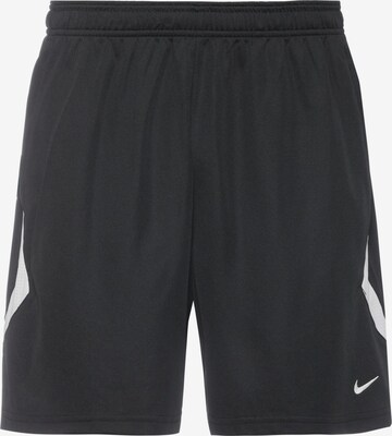 Loosefit Pantalon de sport NIKE en noir : devant